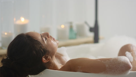 Woman soaking in bathtub