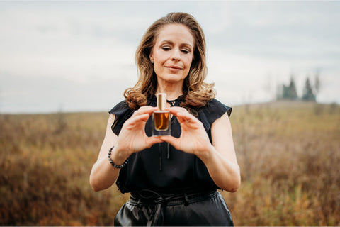 Maria Velve holding perfume