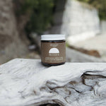 Genesis Magnesium Tallow on a log