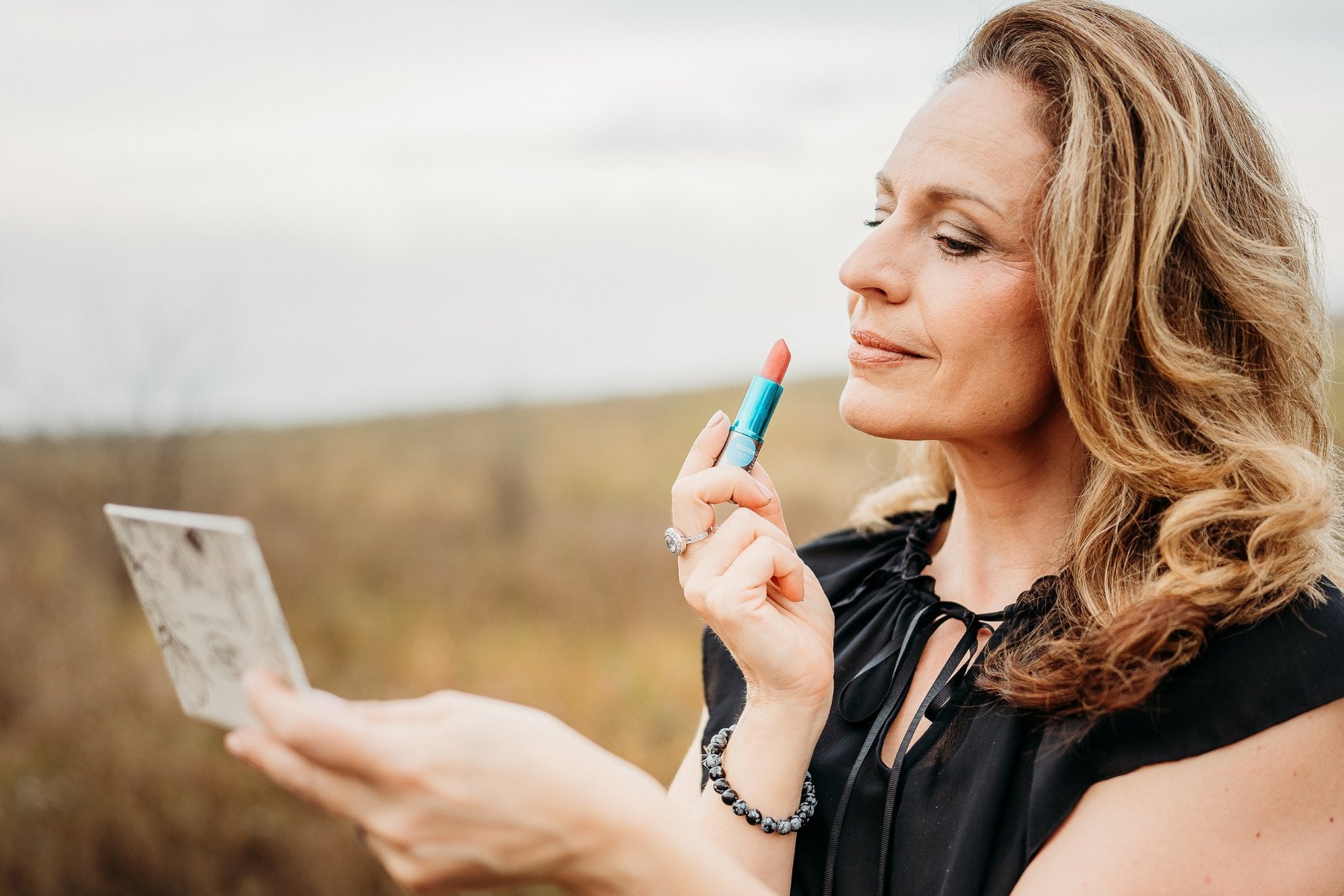 Maria Velve applying makeup