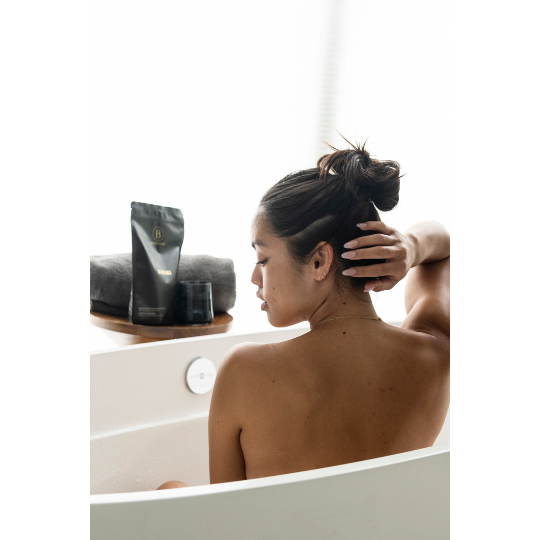 brown woman in bathtub
