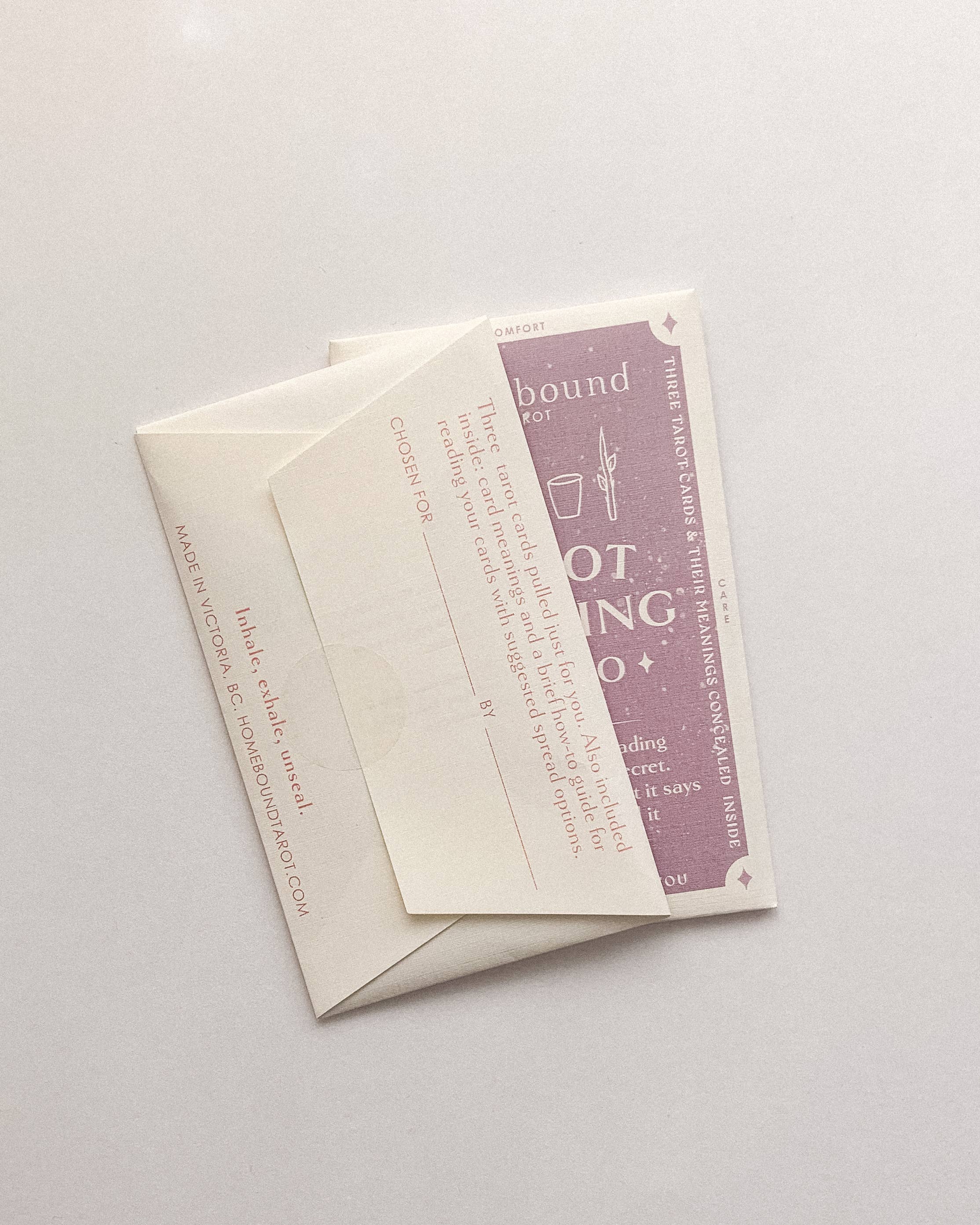 Two Homebound Tarot cards with text and a purple design on a light gray background