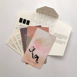 Set of Homebound tarot cards with a deck and an envelope on a light gray background