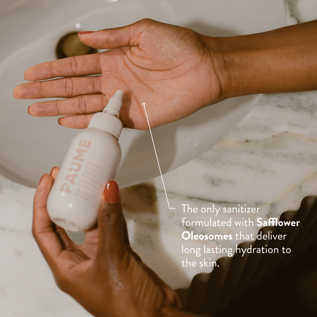 Person applying PAUME hand sanitizing gel to their hand with text about safflower oleosomes.