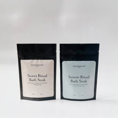 Two packages of Homebound ritual bath soaks on a white background