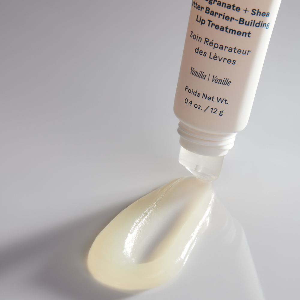 Tube of Three Ships Soft Serve lip treatment with a small amount of product on a white background