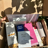 Summer Glow Ritual box containing skincare products with a blurred background