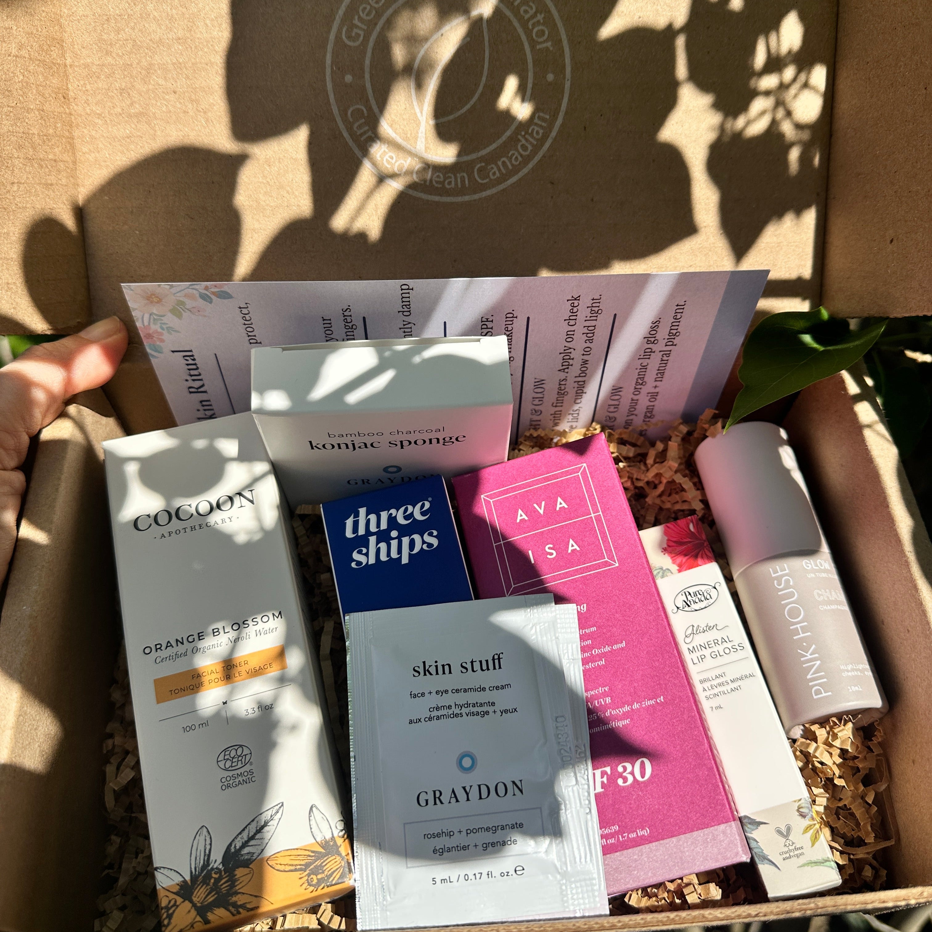 Summer Glow Ritual box containing skincare products with a blurred background