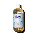 Bottle of The Bathologist Sleep bubble bath with a label on a white background