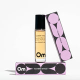 Om Organics Roll-on perfume bottle with packaging labeled 'Om Flower Child' on a white background