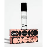 Om Pink Coconut scented rollerball perfume with packaging on a white background