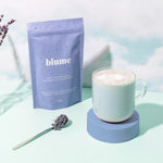Blume tea package with a cup of tea on a light background