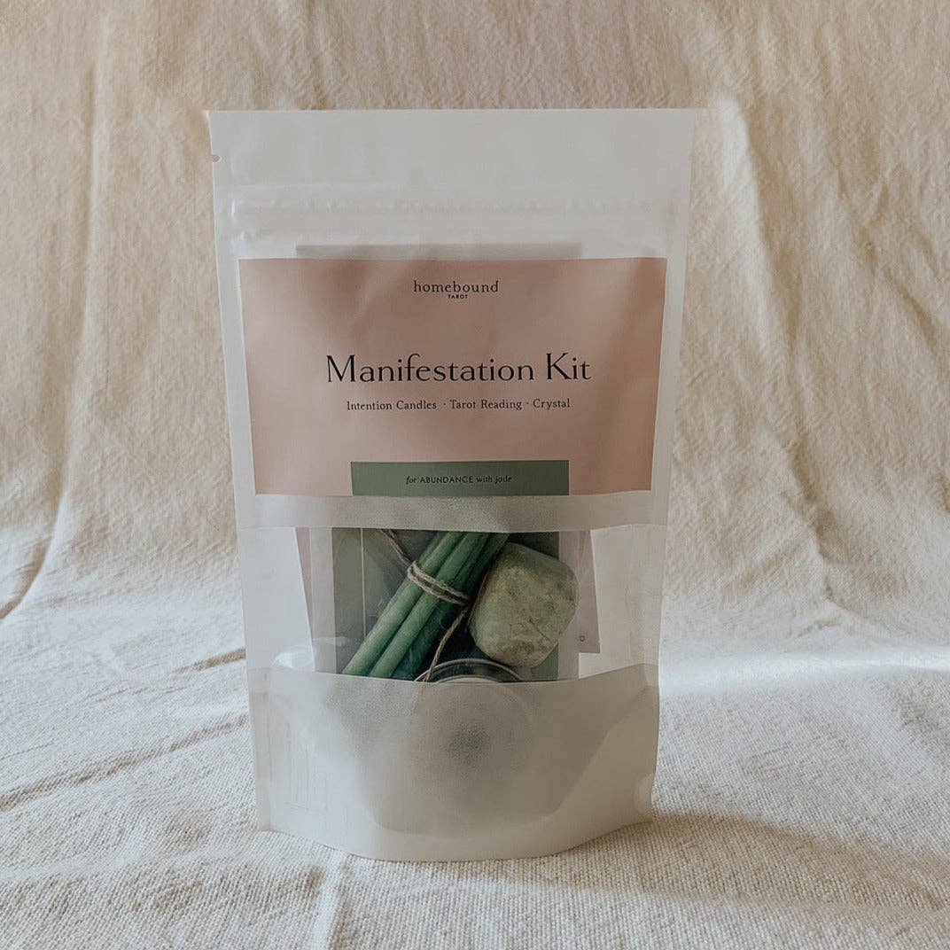 Manifestation Kit packaging with candles and stones.