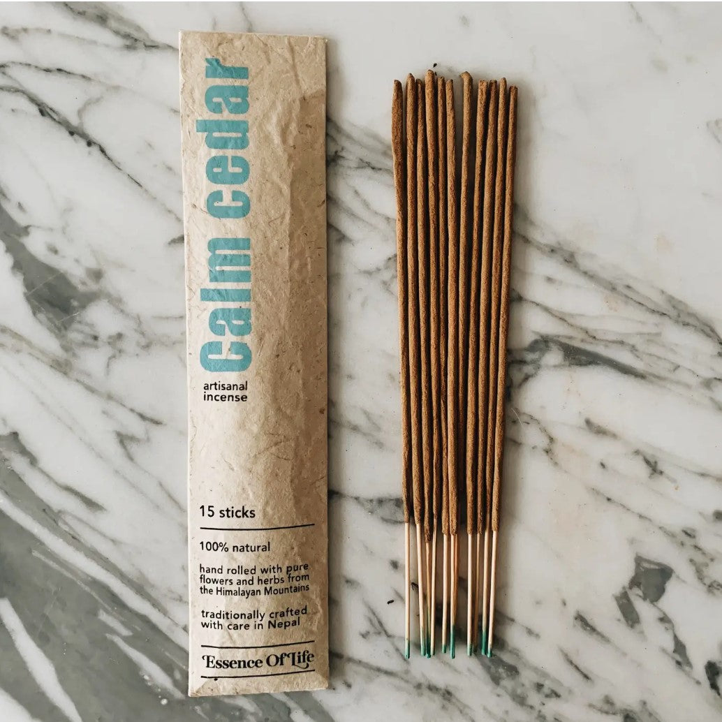 A Essence of Life CALM CEDAR incense sticks with several sticks visible outside the package.