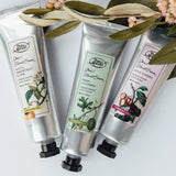 Three tubes of Pure Anada hand cream with labels on a white background