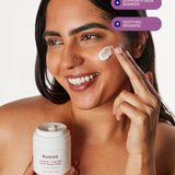 Woman applying Three Ships Restore cream to her face 