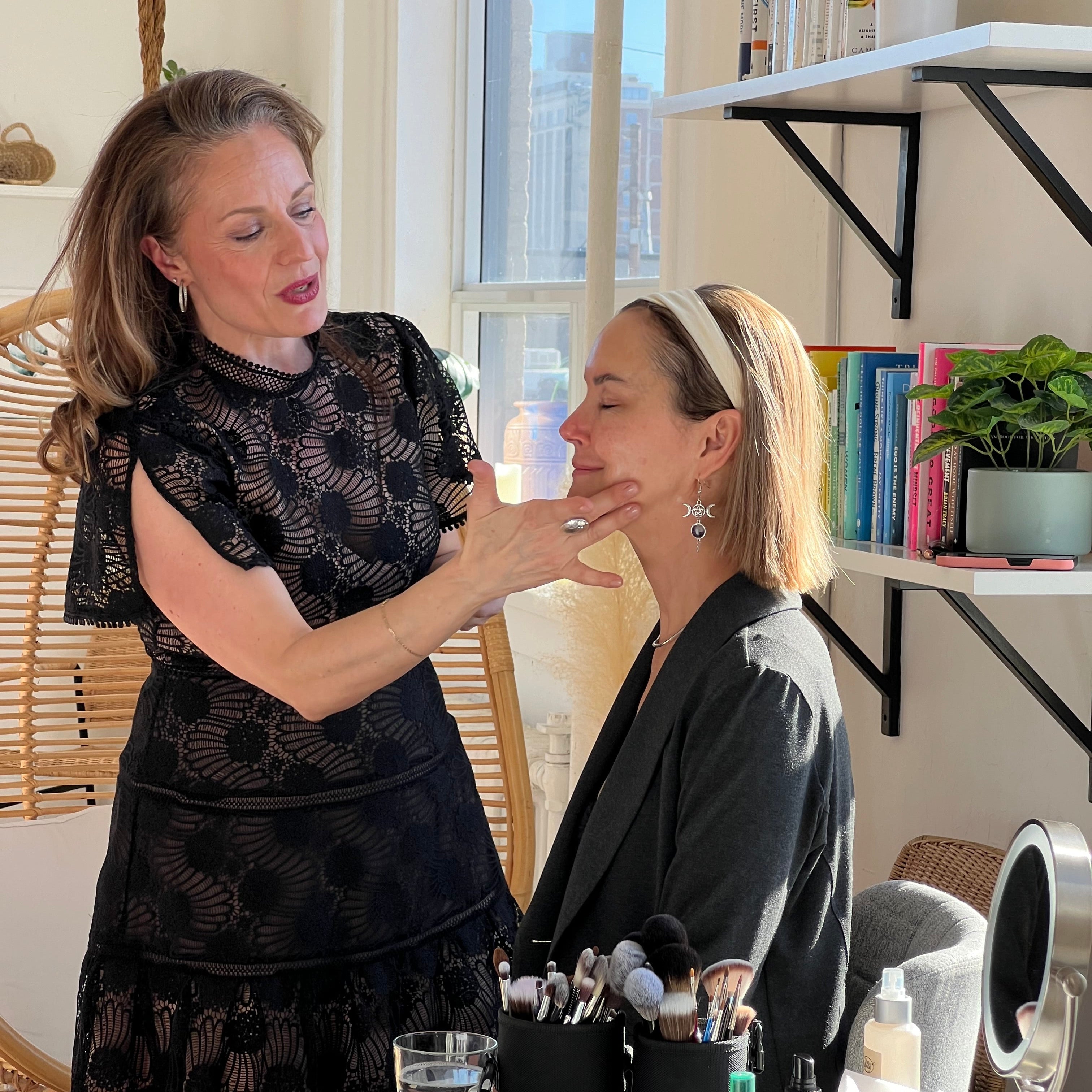 Maria Velve applying skincare on woman over 40