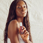 Beautiful woman with Ava Isa Sun to Serum drops