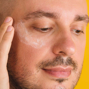 Man applying Consonant Skincare eye cream